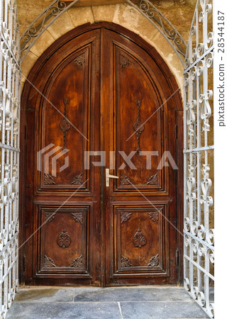 Ancient wooden door in Old city. Baku Ancient wooden door in Old city. Baku 28544187