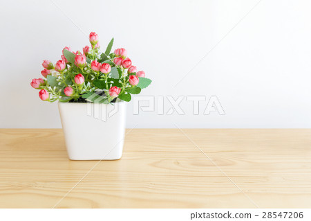 the artificial red flower in the pot 28547206