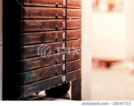 Stack of rusty metal weights in gym bodybuilding 28547723