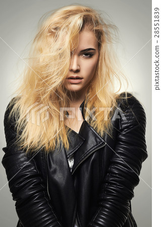 beautiful blond girl in leather coat 28551839