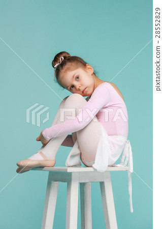 The little balerina dancer on blue background 28552829