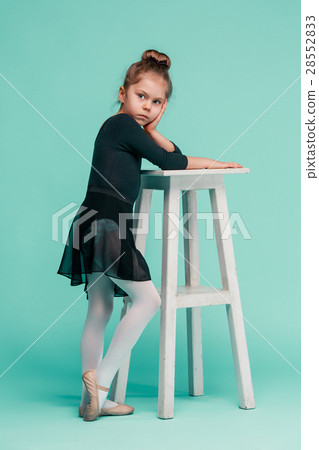 The little balerina dancer on blue background The little balerina dancer on blue background 28552833