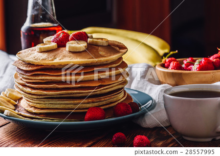 Pancakes with Tea Cup and Fruits. 28557995