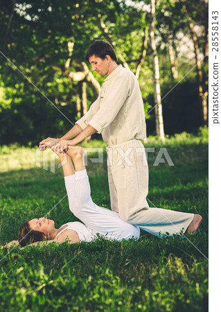 Thai massage with yoga exercises 28558143