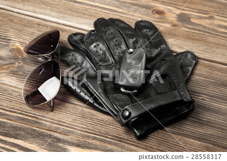 Car keys and driving gloves 28558317