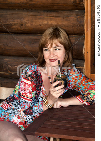 Portrait of the woman drinking a mate 28558565