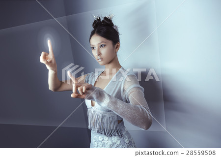 Future concept. Young pretty asian woman touching Future concept. Young pretty asian woman touching 28559508