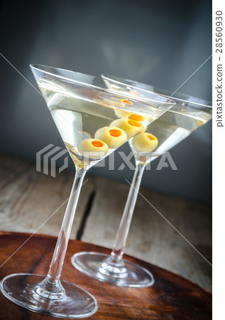 Two olive martini cocktails 28560930