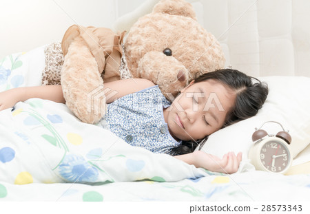 Adorable little girl sleeping in the bed 28573343