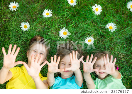 Group of happy children playing outdoors 28576157