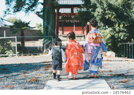 festival day for children of three, five and seven years of age, visiting shrine or temple, older sister and younger brother 28576462