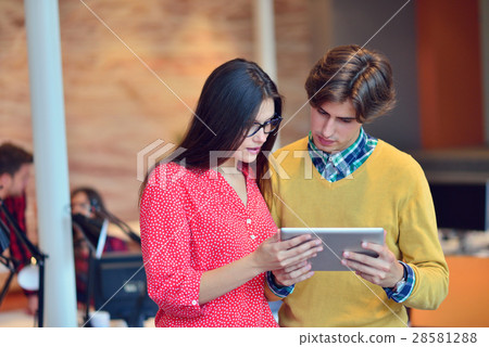 Young people with tablet in the office 28581288