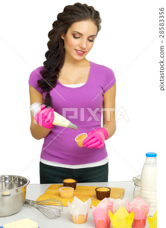 Young woman the chef prepares food Young woman the chef prepares food 28583356