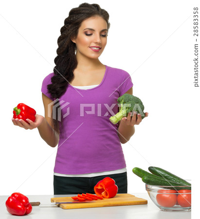 Young woman the chef prepares food 28583358