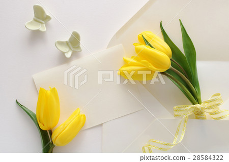 Gift with yellow tulips and cards Gift with yellow tulips and cards 28584322