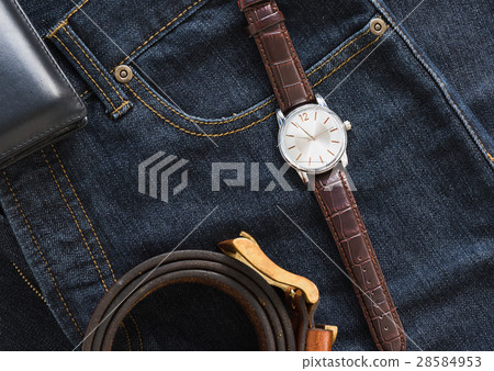 Wristwatch and wallet on denim jeans pocket Wristwatch and wallet on denim jeans pocket 28584953