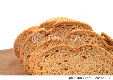 sliced loaf of bread on a cutting board  28586884