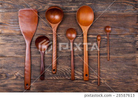 Assorted wooden tableware on wooden table 28587613