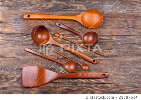 Assorted wooden tableware on wooden table 28587614
