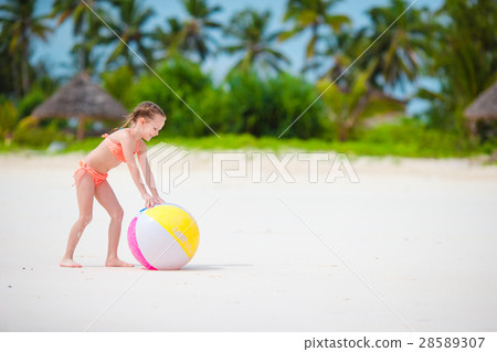 Cute little girl playing with ball on beach, kids 28589307