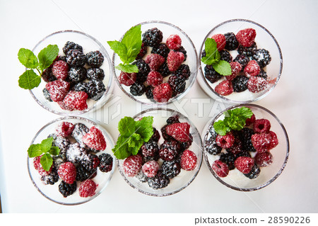 Blackberry and raspberry in the white yogurt. Blackberry and raspberry in the white yogurt. 28590226