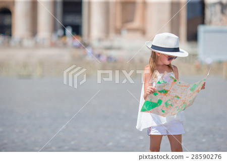 Adorable little girl with touristic map in St 28590276