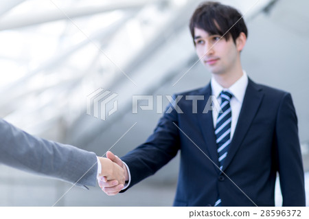 Male and female to shake hands 28596372