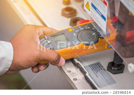 engineer working on checking and maintenance equipment 28596814