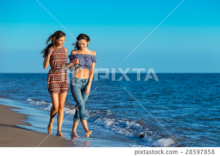 Pretty girl has a fun with her girlfriend on the Pretty girl has a fun with her girlfriend on the 28597858