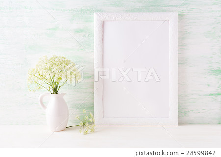 White frame mockup with delicate wild field flower White frame mockup with delicate wild field flower 28599842