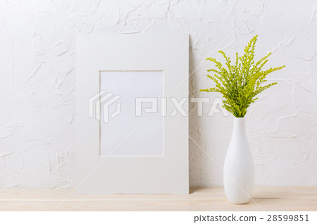 White mat frame mockup and grass in exquisite vase White mat frame mockup and grass in exquisite vase 28599851