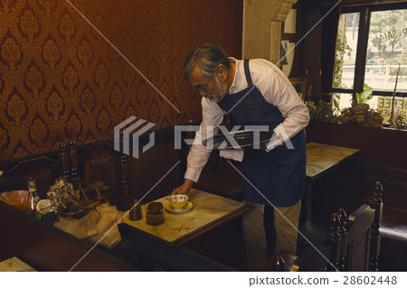 Men clearing the table Men clearing the table 28602448