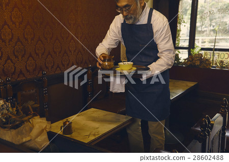 Men clearing the table Men clearing the table 28602488