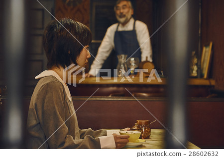 Shop owner and customer of a coffee shop Shop owner and customer of a coffee shop 28602632