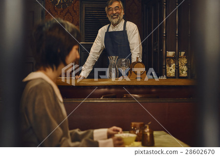 Shop owner and customer of a coffee shop Shop owner and customer of a coffee shop 28602670
