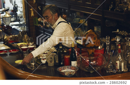 Men polishing cups 28602692