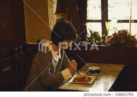 A woman eating Napolitan A woman eating Napolitan 28602765