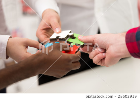 business people group assembling jigsaw puzzle and business people group assembling jigsaw puzzle and 28602919