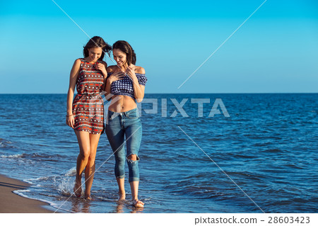 Pretty girl has a fun with her girlfriend on the 28603423