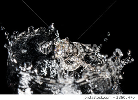 Wedding Rings Sinking in Water, Black Background 28603470