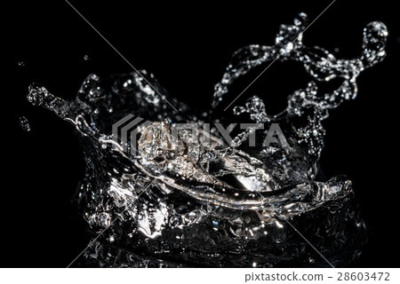 Wedding Rings Sinking in Water, Black Background 28603472