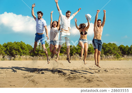 Group of friends together on the beach having fun. 28603555