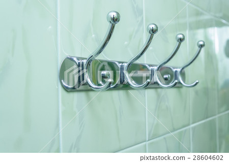 Cloth hanger on tile background Cloth hanger on tile background 28604602