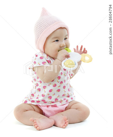 Asian baby girl biting on teething toy Asian baby girl biting on teething toy 28604794