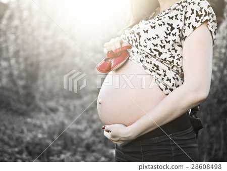 Close up of unrecognizable pregnant woman Close up of unrecognizable pregnant woman 28608498