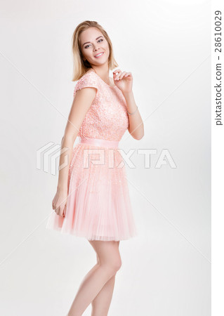 beautiful blond woman in a pink cocktail dress 28610029