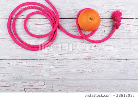 The orange stands near jump rope 28612055
