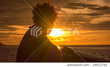 Papuans in Sunset light on the Way to Kri Island Papuans in Sunset light on the Way to Kri Island 28612782