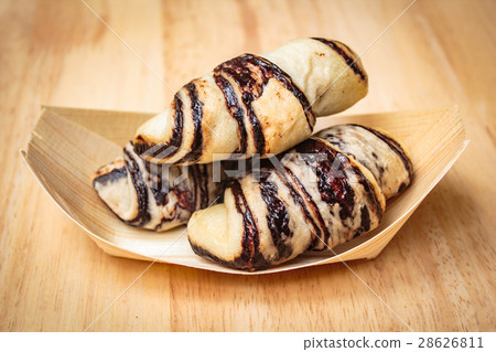 Fresh tasty croissants on wooden background. Fresh tasty croissants on wooden background. 28626811
