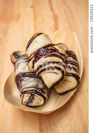 Fresh tasty croissants on wooden background. Fresh tasty croissants on wooden background. 28626813
